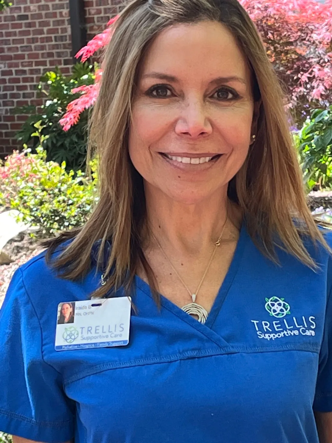 Trellis nurse Iriada in her blue scrubs